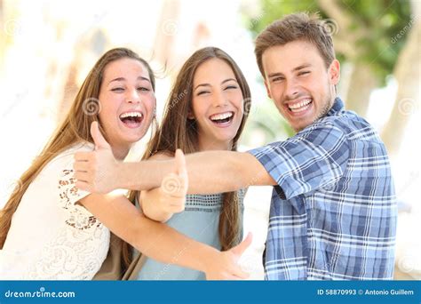 Three Happy Teenagers Laughing With Thumbs Up Stock Image Image Of Hand Adults 58870993