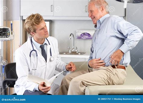 Doctor Examining Male Patient With Hip Pain Stock Image Image Of