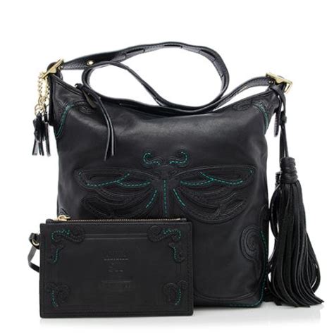 Starbucks has teamed up with anna sui to create this gorgeous limited edition collection: Coach Anna Sui Limited Edition Dragonfly Duffel Bag