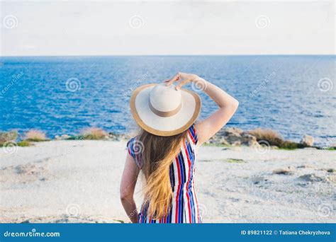 happy woman enjoying beach relaxing joyful in summer by tropical blue water beautiful model