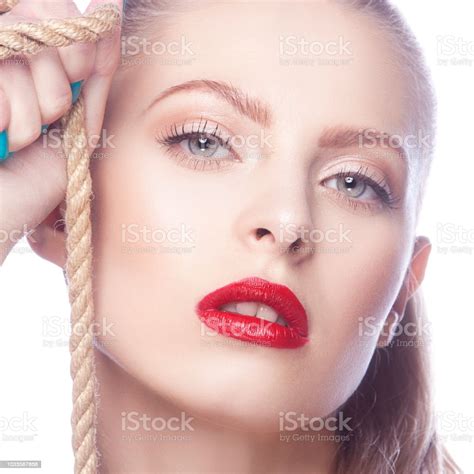 Closeup Beauty Face Of Model Girl With Bright Red Lips Makeup And Clean