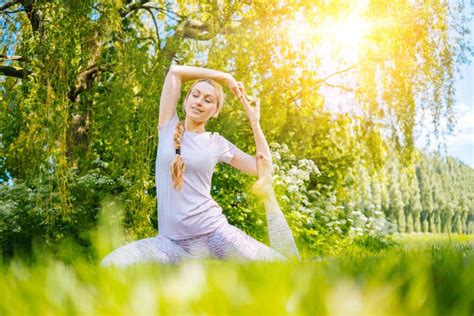 Young Woman Doing Yoga Asana In Park Girl Stretching Exercise In Yoga Position Happy And