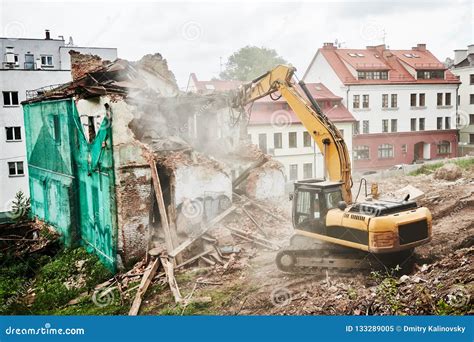 Excavator Crasher Machine At Demolition On Construction Site Stock