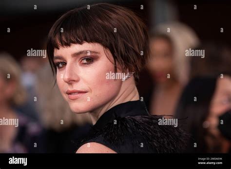 Jessie Buckley Poses For Photographers Upon Arrival At The Premiere Of