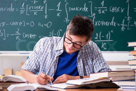 The Young Male Student Studying Math At School Stock Image Colourbox