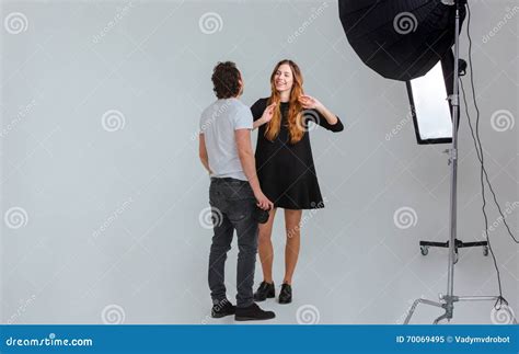 Male Photographer Speaking With Female Model Stock Image Image Of Human Cheerful 70069495