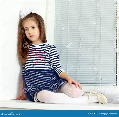 Sad Little Girl Sitting By The Window Stock Photo Image Of Face
