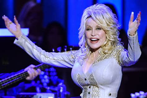 Dolly Parton Tattoos Photos Dolly Parton 73 Admits She Has Several Flower And Butterfly