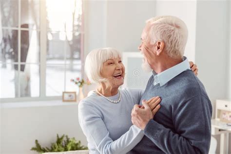Happy Senior Couple Dancing In The Living Room Stock Image Image Of