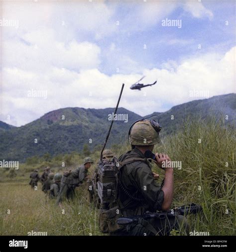 Members Of B Troop 1st Squadron 9th Cavalry Watch A Huey Helicopter