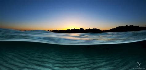 Award Winning Ocean Photographer Captures Breathtaking Half Underwater