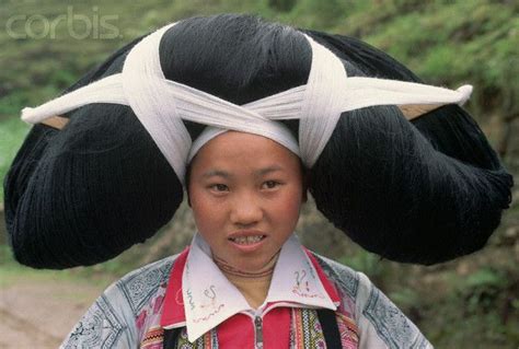 A Woman From The Long Horn Miao Tribe Wears A Ceremonial Hairpiece