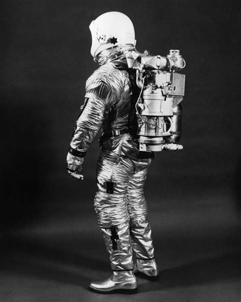 1960s Side View Of Astronaut Wearing Helmet Nasa Space Suit Posters