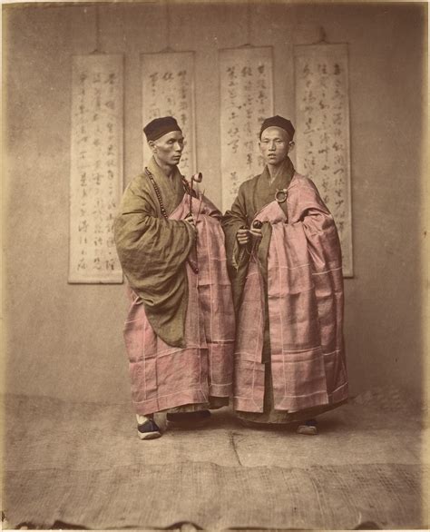Unknown Two Chinese Men In Matching Traditional Dress The