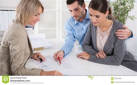 Unit linked insurance plans (ulips), 2. Professional Business Meeting: Young Couple As Customers And An Stock Photo - Image: 52234433