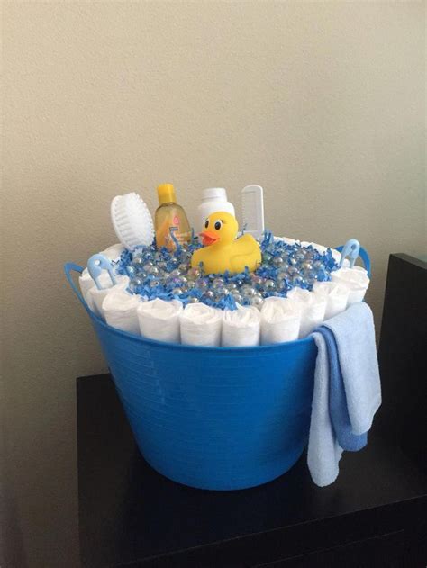Begin with the top tier tuck the various baby accessories inside the ribbon, all around the cake. Latest help and information for baby shower diaper cake ...