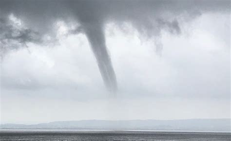 Waterspouts fall into two categories: Waterspout photographed forming over the waters of the ...