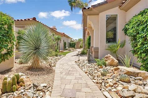 House With Desert Landscaping Paver Path Cactus And Rocks Landscaping