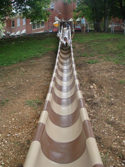 Maybe you would like to learn more about one of these? Here's an amazing hillside slide built right onto the landscape at the local Children's Home ...