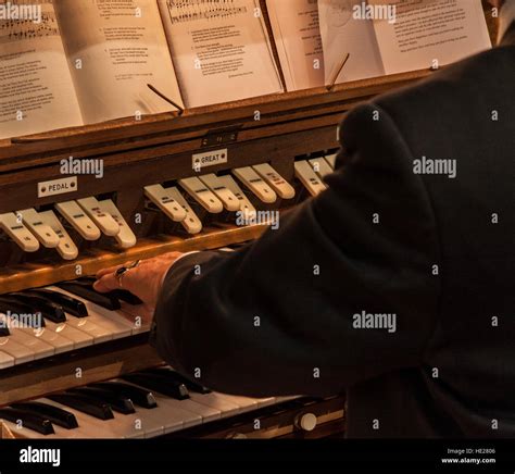 A Church Organist At Work Playing During A Wedding Ceremony Stock Photo