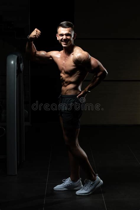 Muscular Bodybuilder Flexing Muscles Stock Photo Image Of