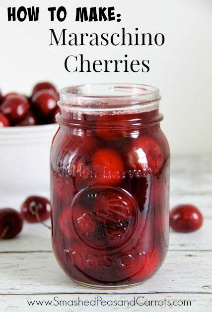 A Jar Filled With Cherries Sitting On Top Of A Table