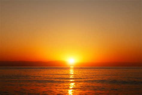 Sunrise Over Water Stock Photos Pictures And Royalty Free Images Istock