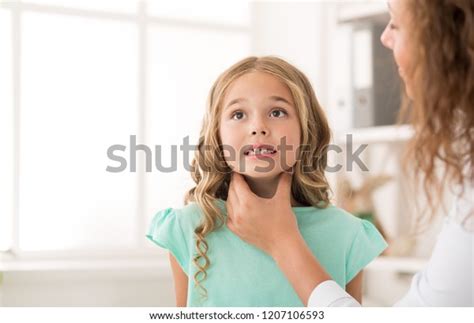 Swollen Tonsils Female Doctor Examining Girl Stock Photo 1207106593
