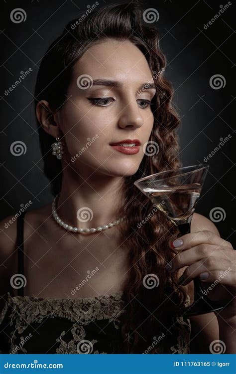 Portrait Of A Beautiful Woman With Glass Of Martini Stock Image