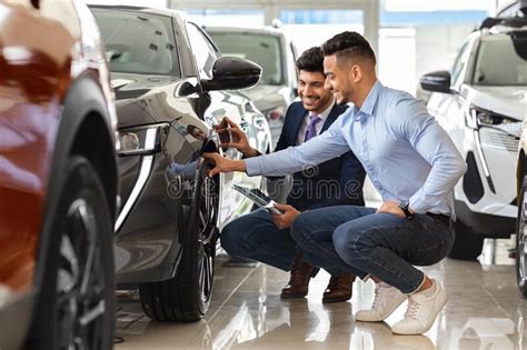 Handsome Arab Guy Customer Choosing New Sports Car Stock Image Image Of Transport Sitting