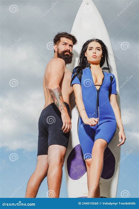 summer couple vacation woman in swimsuit summertime concept sunbathing surfboard stock