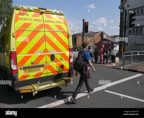 Ambulances At An Accident Scene On A Pedestrian Crossing On A Dual
