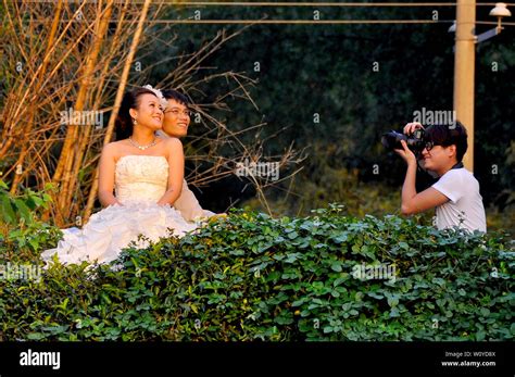 Chinese Couple Have Wedding Photos Taken By River In Yangshuo Guilin