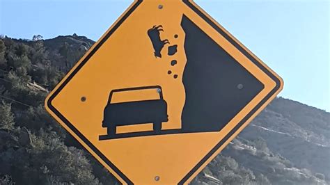 Road Sign Showing Cow Plummeting Off Cliff Was Made After Event