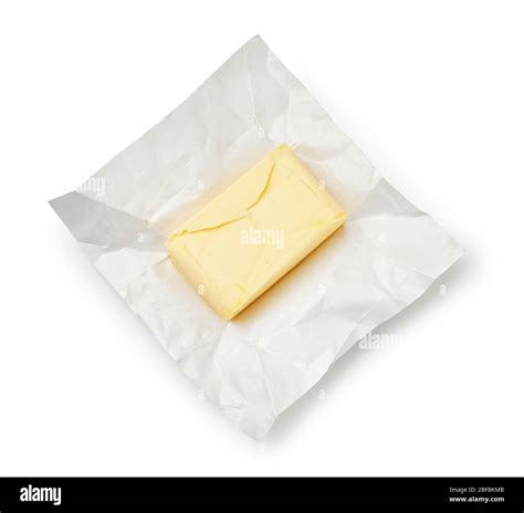 Piece Of Butter On Package Paper Isolated On White Background Top View