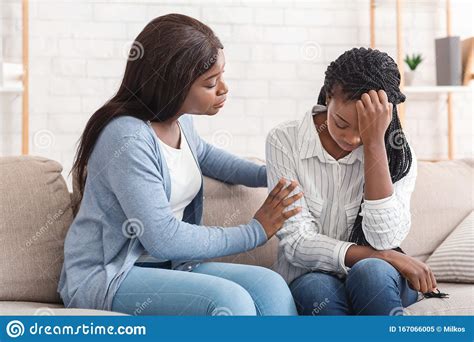 Young Black Woman Supporting Her Depressed Friend At Home Stock Image ...