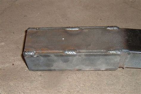 An Old Metal Box Sitting On The Floor