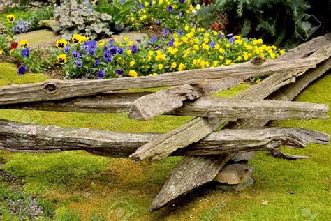 Rails placed narrow side up sag the least and are recommended for heavy fences and those with posts that are 6 feet or more apart. Stock Photo | Fence landscaping, Split rail fence, Rail fence