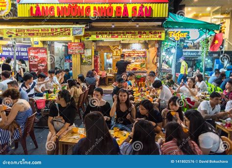 Ho Chi Minh City Vietnam Vietnamese People At Open Air Restaurant At Night In Bui Vien Street