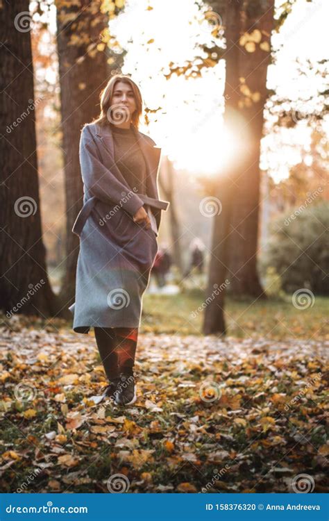 Pretty Girl Walking In Autumn Park Beautiful Autumn Sunny Weather