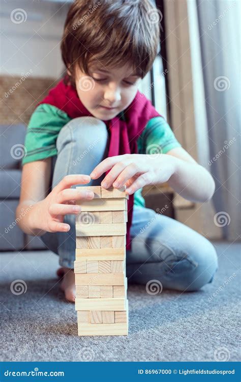Boy Playing Jenga Game At Home Stock Photo Image Of Caucasian Jenga