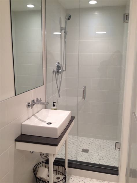 Looks like having a stacked washer and dryer is a pretty good idea for small bathroom. Basement Shower | Smalltowndjs.com