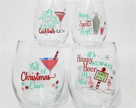 Four Wine Glasses With Different Designs And Sayings On The Glass Are Sitting Side By Side