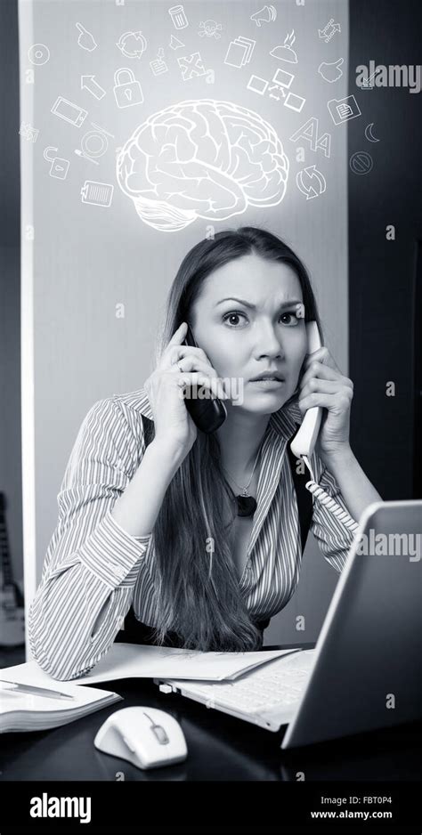 Office Worker Talking On Two Cell Phone Stock Photo Alamy
