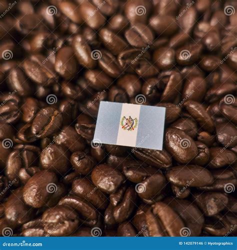 A Guatemala Flag Placed Over Roasted Coffee Beans Stock Photo Image