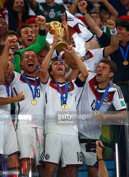 Philipp Lahm Of Germany Lifts The World Cup Trophy With Teammates