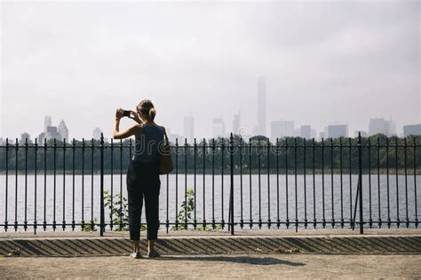 Tourist Woman Taking Travel Picture Of New York City Skyline With