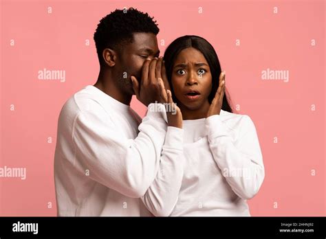 Black Man Sharing Secrets With His Emotional Girlfriend Stock Photo Alamy