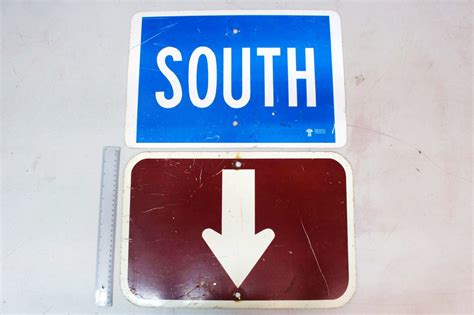 Road Signs 2south And An Arrow Pointing Up Or Down