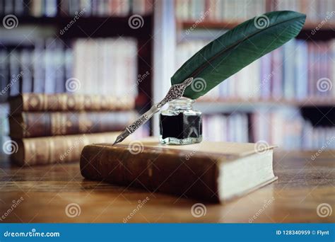 Quill Pen On An Old Book In A Library Stock Image Image Of Bookshelf